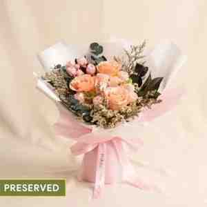 Champagne Elegance Preserved Peach Rose Bouquet - A graceful preserved bouquet featuring premium pea