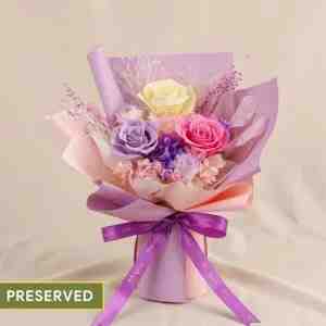 Pastel Symphony Preserved Mixed Rose Bouquet - A romantic arrangement featuring 3 roses in taro p